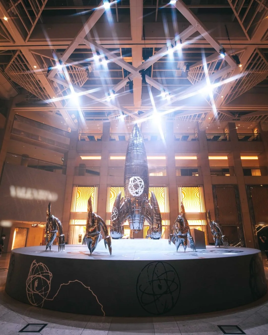 Installation view, FUTURALAND, Landmark, Hong Kong, 3–16 June 2021. The FL-006 launch crew ranged around the X-6000 rocket.