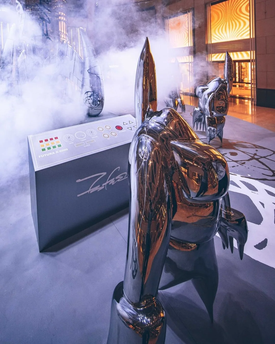 Installation view, FUTURALAND, 2021. FL-006 figure beside the console, its panel lettered FUTURA X-5000 though the rocket is the X-6000.